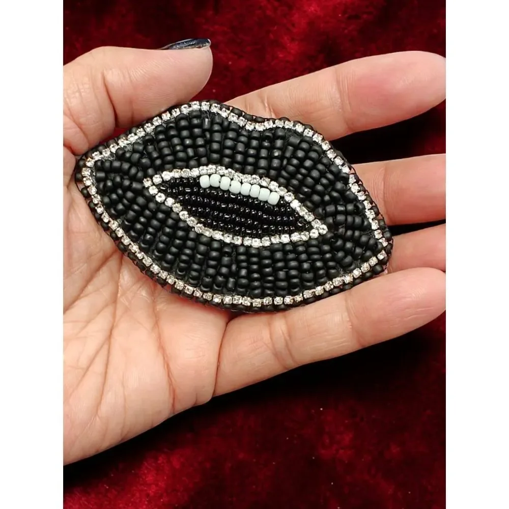 Designer's Murka Matte Black Beaded Lip Brooch with Crystal Accent